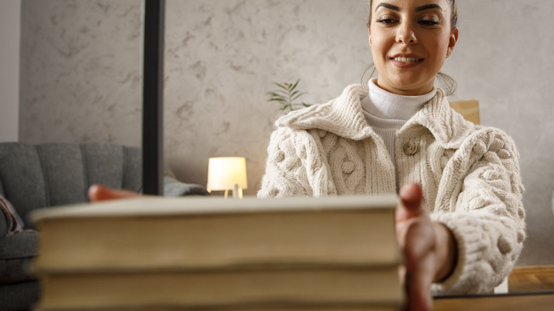 Woman organizing books