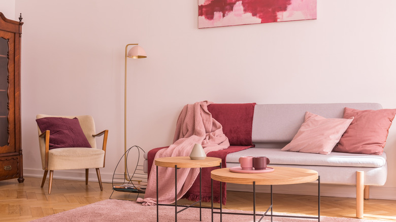 A color drenched pink living room.