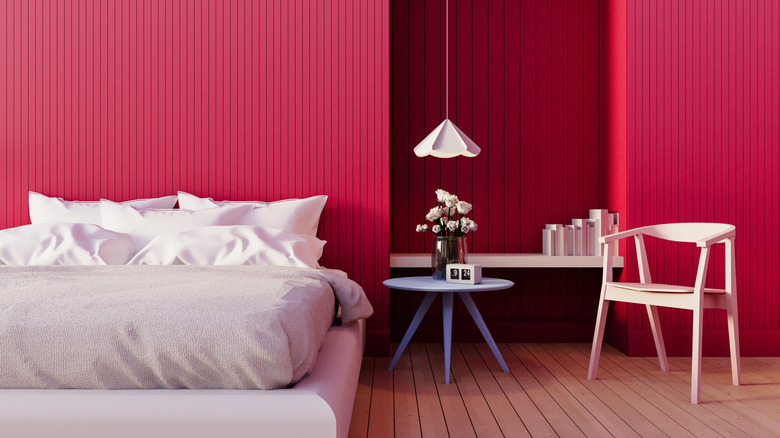 A bright, all pink bedroom with fuscia walls.