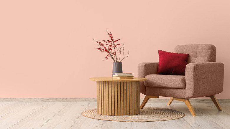 Beige-pink wall with chair in similar color