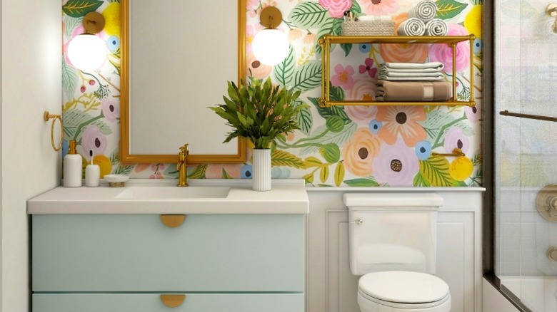 Pastel candy-colored bathroom with floral wallpaper