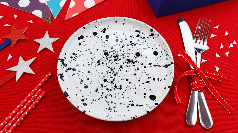 Splatterware plate on festive red, white, and blue decorated table