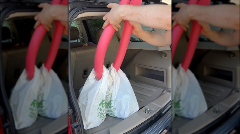 Grocery bags on pool noodle 