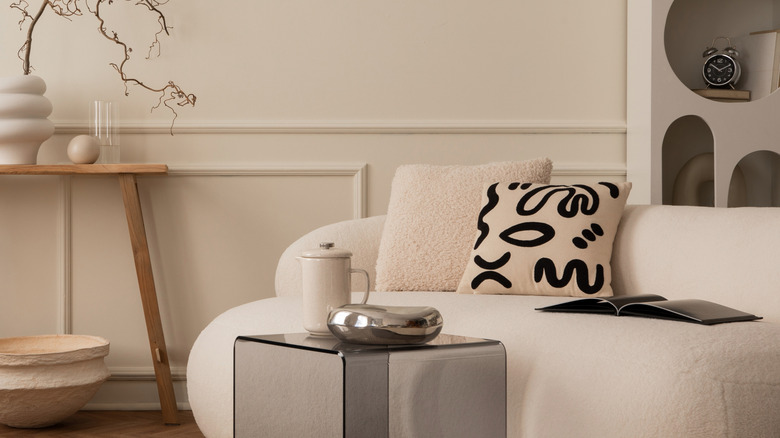 Living room with chrome accent and white sofa