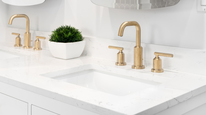 A white and gray marble vanity countertop