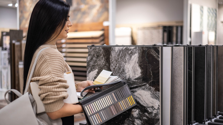 Someone looking at materials for her bathroom