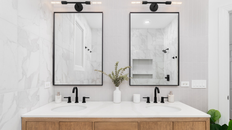 A bathroom vanity with pure white countertops