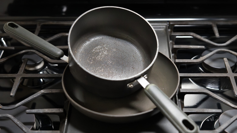 nonstick pot and pan stacked on top of stove