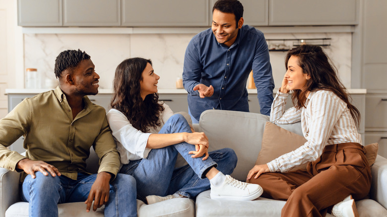 Woman standing awkwardly at party