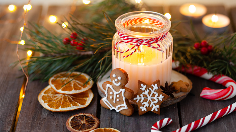 A scented candle on a holiday table.