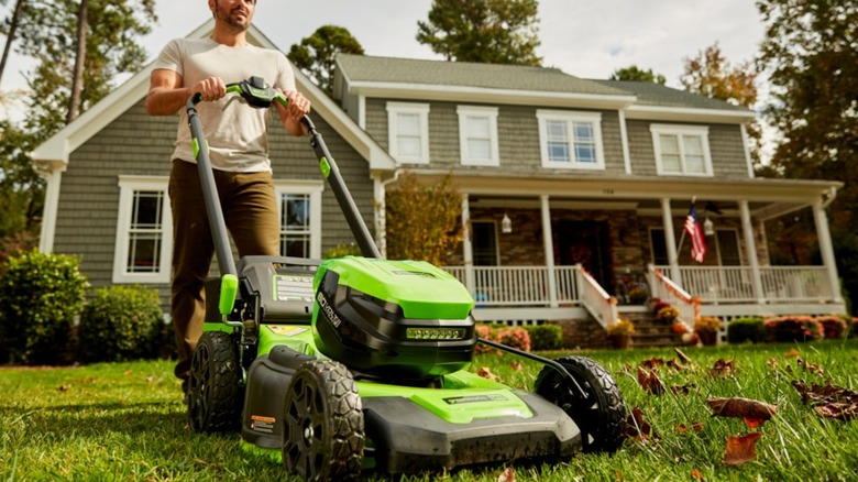 Man pushing lawn mower