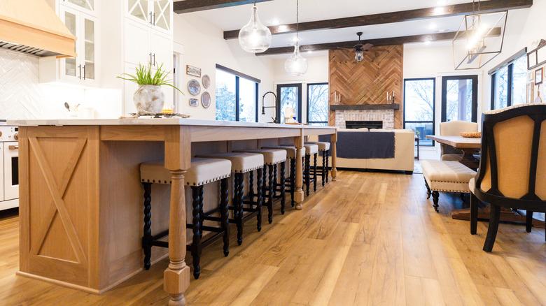 a rustic open-concept kitchen with a wooden island