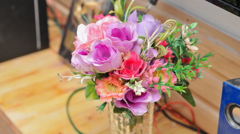 Bouquet of fake flowers on table
