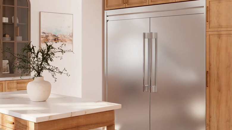 a modern kitchen with a large, double-door Frigidaire fridge