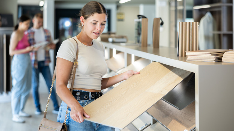 Woman looking at flooring options for her home