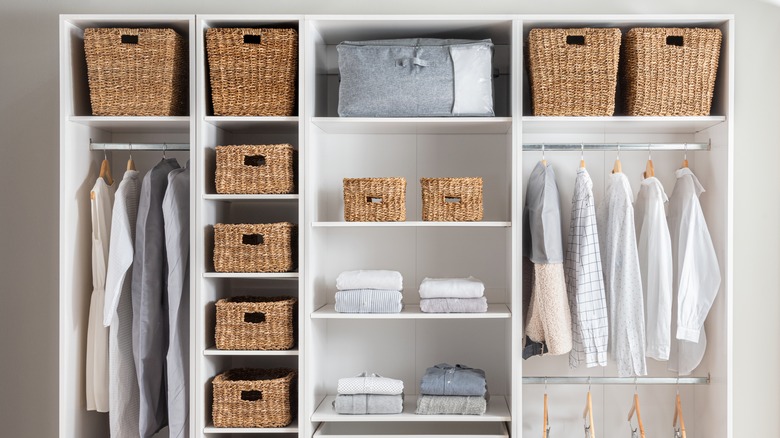 Neatly organized closet with wicker baskets