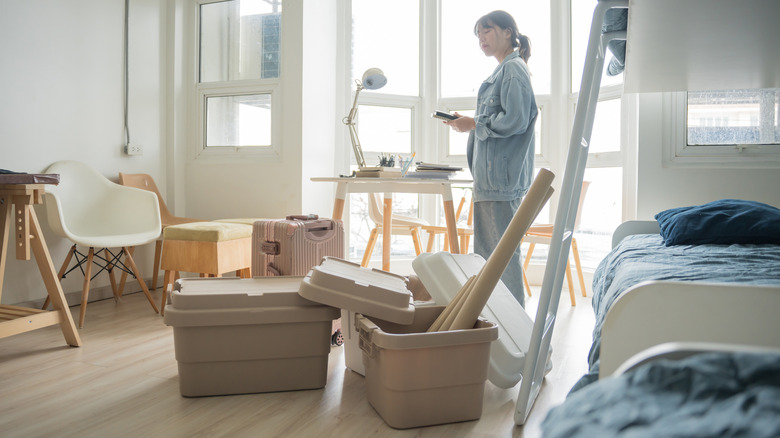 Woman organizes a room