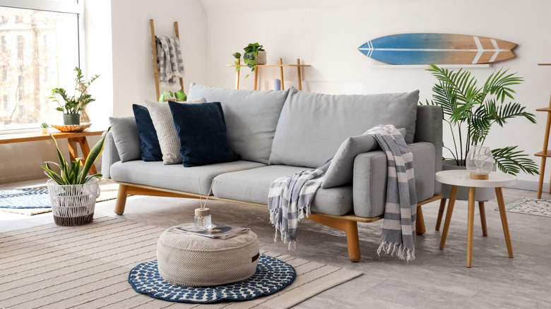 beach house living room with layered rugs and small sofa