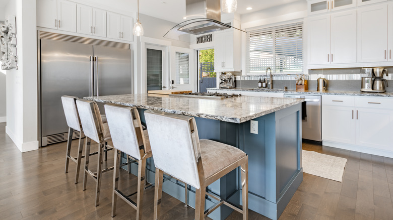 Upholstered chairs at kitchen island