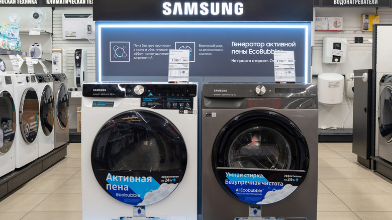 A Samsung front-loader washer and dryer on display at a Russian store