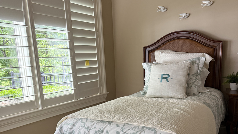 A pillow with a block font on it