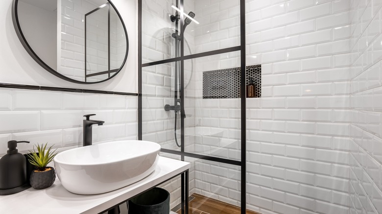 White tile shower with niche