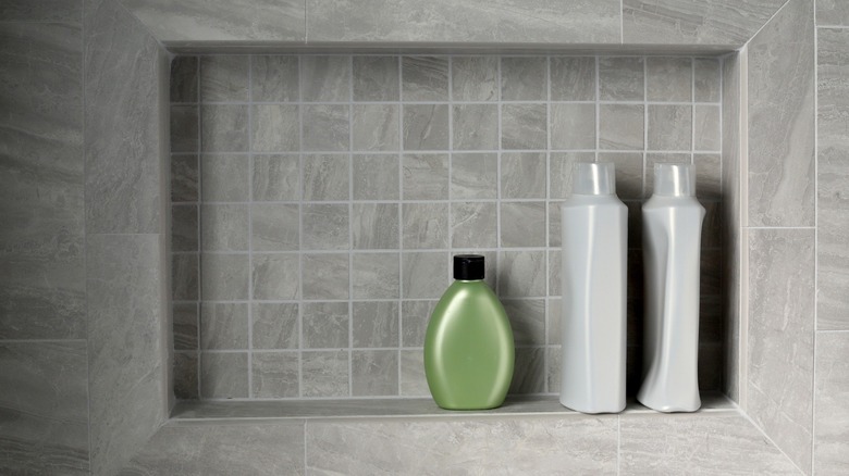 Shower niche with shampoo bottles