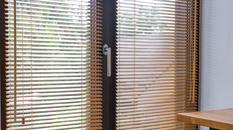 Double front door with faux wood blinds