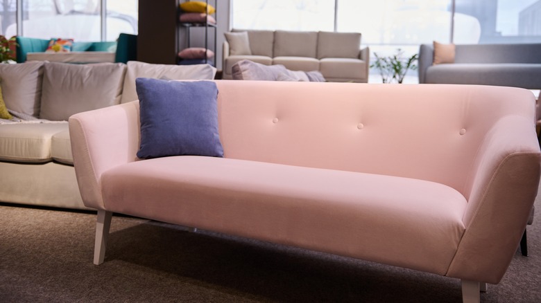 Pink upholstered sofa in showroom