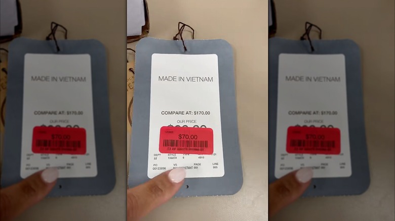 A price ticket with a red clearance sticker on it.