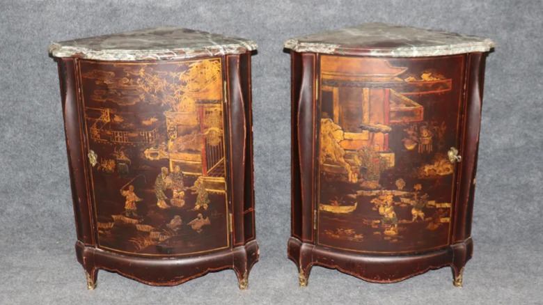 Two corner cabinets with painted scenes and marble tops were made by Maison Jansen.