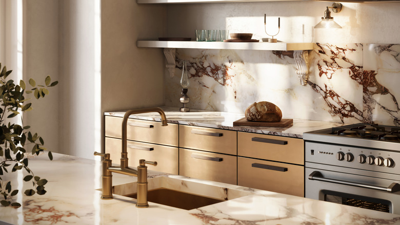 A contemporary kitchen with marble style countertops.
