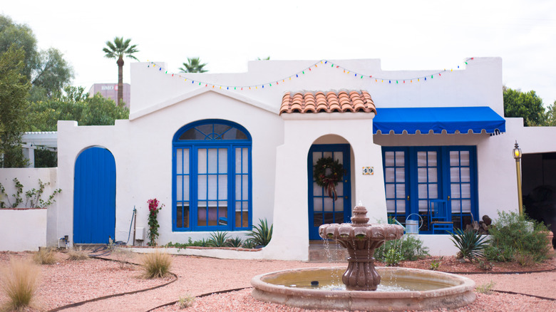A home with a front yard water feature.