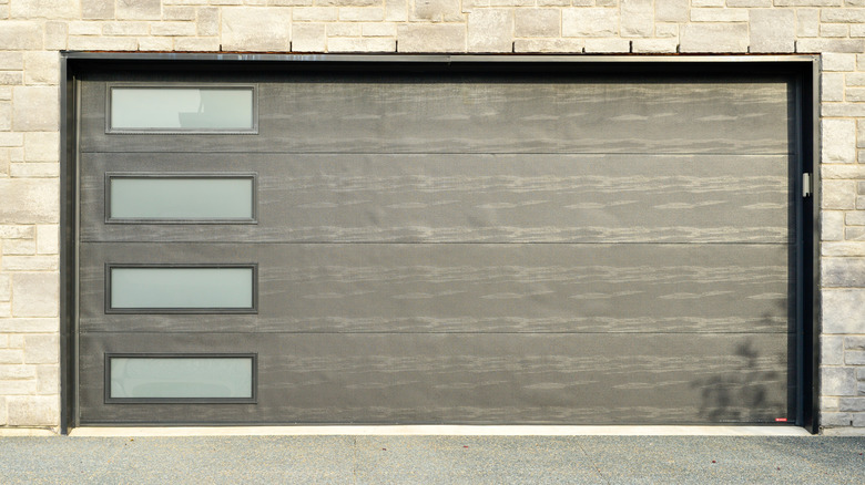 A modern garage door with windows.