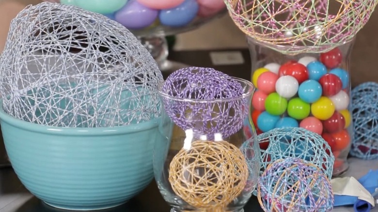 String Easter eggs styles with bowls and vases.