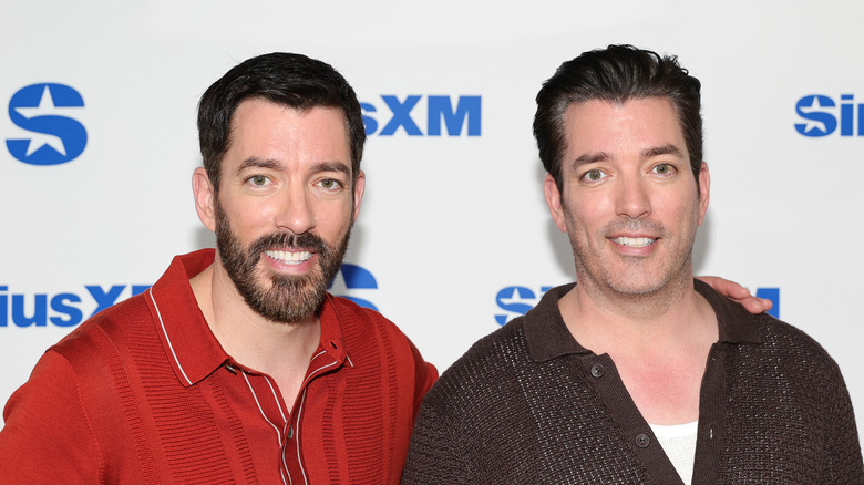 Drew and Jonathan Scott pose for a photo at a joint appearance