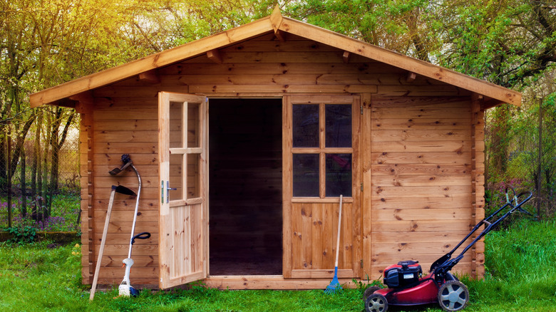 Wood garden shed in backyard