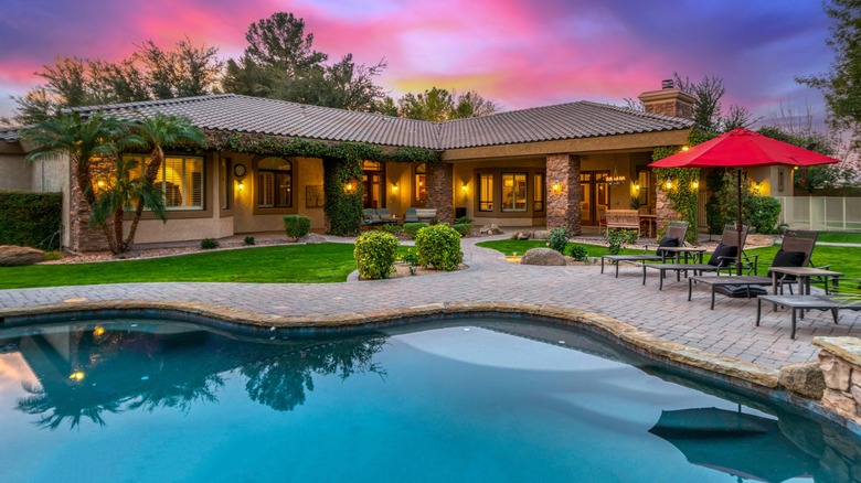 Backyard with pool and palm trees