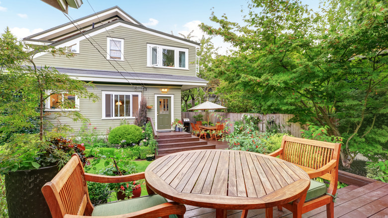 Clean backyard and outdoor furniture during the day