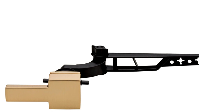 A gold Delta Vero Trip Lever is shown in detail