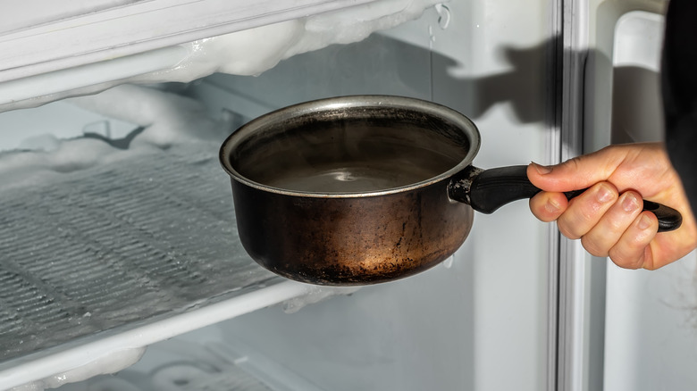 person place pot in freezer