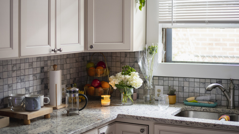 White kitchen cabinets with round knobs
