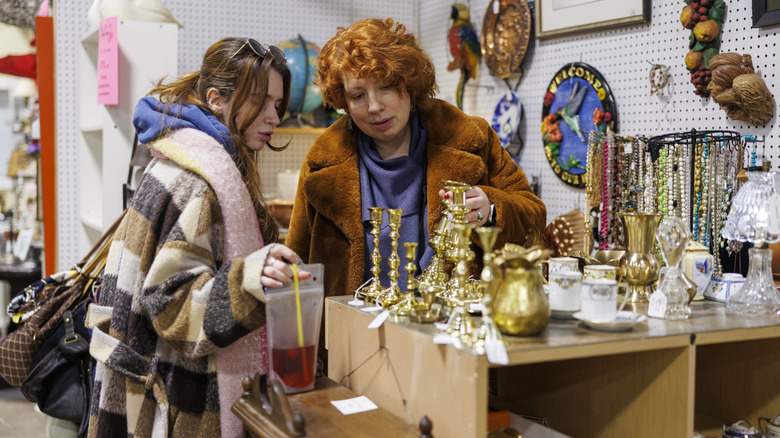Two women examining the offerings at an antique store