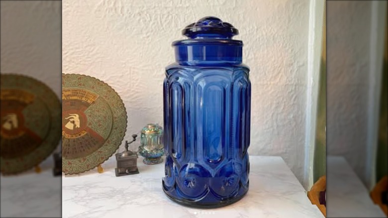 tall blue glass cannister withy moon and stars