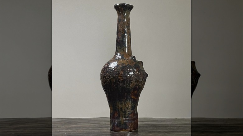 Tall, organically shaped George Ohr vase