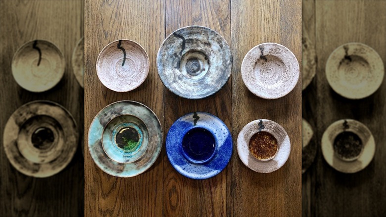 A range of McCarty pottery pieces from vintage to modern