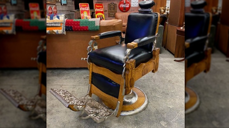 Antique Koken barber chair with black leather