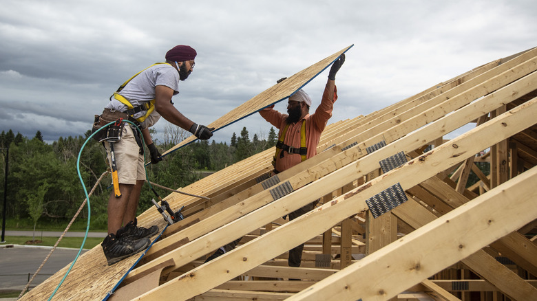 workers installing roof