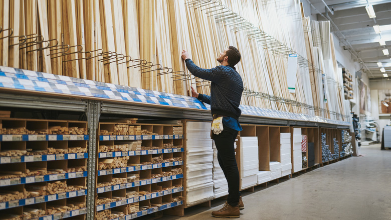 man shopping for lumber