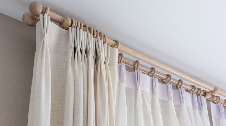Pinch pleat curtains with wooden rings